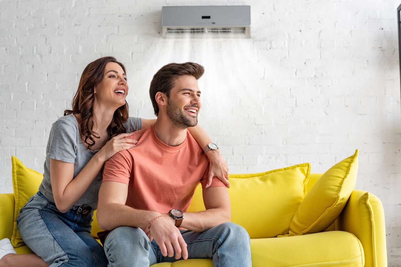 couple at home with ac system